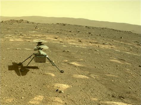 The new images show ingenuity hovering and then landing against a stunning backdrop: NASA Ingenuity Helicopter Photographed Mars Surface Before ...