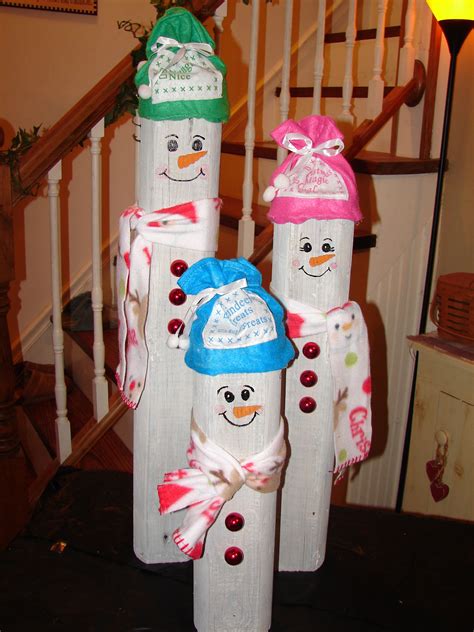 these are my little snowmen i made using a recycled landscape timber i love the way they turned