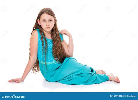 A Girl Of 10 11 Years Old In A Long Emerald Dress With Bare Feet