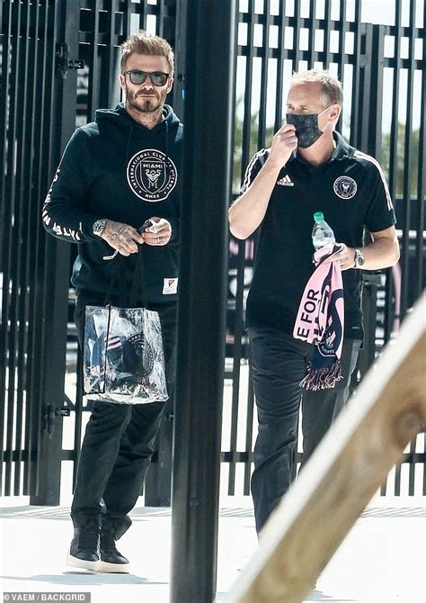 David Beckham Is Cool In A Hoodie And Sunglasses As He Arrives At The