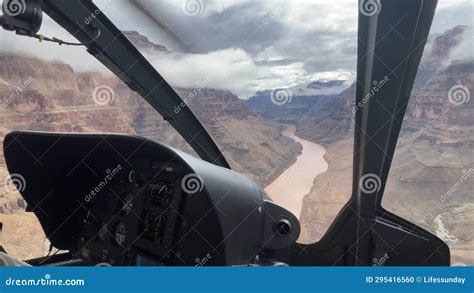 helicopter flying over the colorado river through the grand canyon of colorado in the western