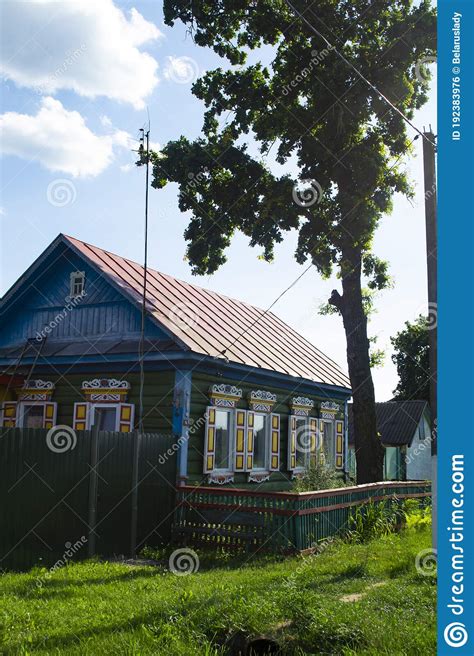 Rural Wooden House With Carved Ornamental Windows In Belarus Stock