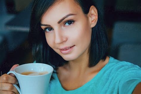 Attractive Young Woman Drinking Coffee By Danil Nevsky Stocksy United