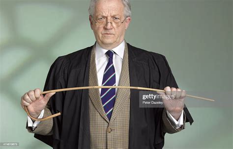 Teacher Cane And Gown High Res Stock Photo Getty Images