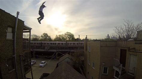 First Person Gopro Video Of A Stuntman Jumping Onto And Sliding Down A Steep Gable Roof In