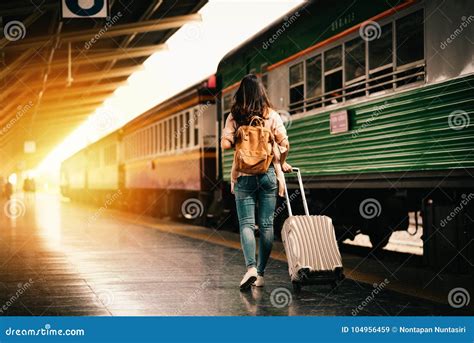 Woman Traveler Tourist Walking With Luggage At Train Station Stock