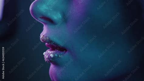 close up beautiful mouth girl on the side beauty portrait of a face in profile with lush lips