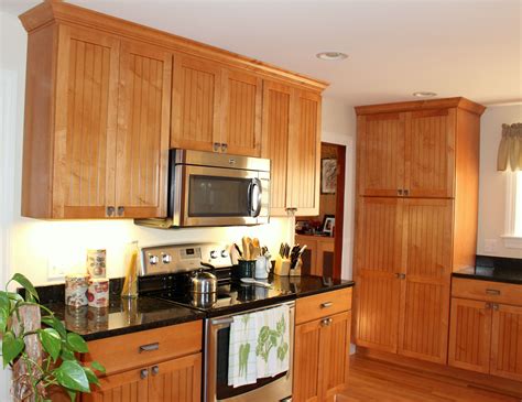 The Cabinet Doors Are A Shaker Style Bead Board In Natural Wood The