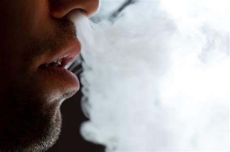 Premium Photo Seductive Male Lips Blowing Cigarette Smoke