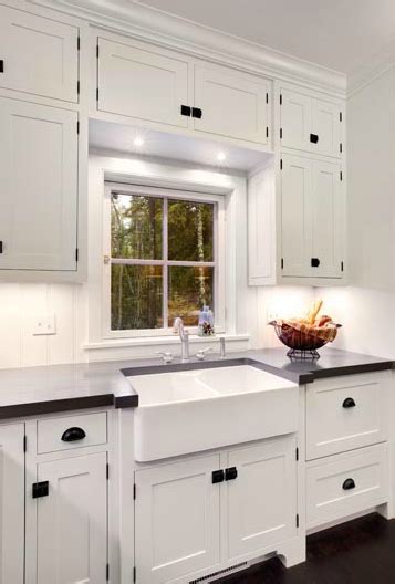 For example, the stark contrast between antique white shaker kitchen cabinets. Suzie: Mitch Wise Design - Floor to ceiling glossy white ...