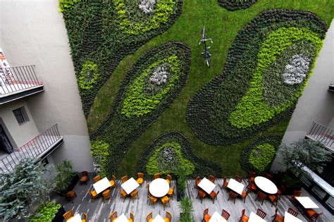 A Bike Was Added To This Huge Green Wall For A Bit Of Whimsical Fun