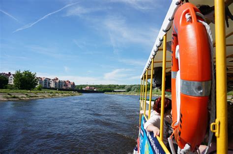 Bright Summer Day With An Excursion Boat With People On The Warta River