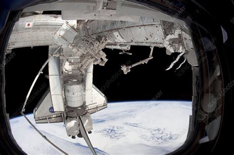 Discovery Docked With The Iss Sts 133 Stock Image C0104109