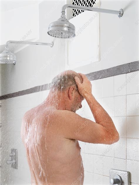older man showering in locker room stock image f018 8774 science photo library