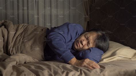 Sleepy Elderly Old Asian Woman People Lying And Sleeping On Bed People Images ~ Creative Market