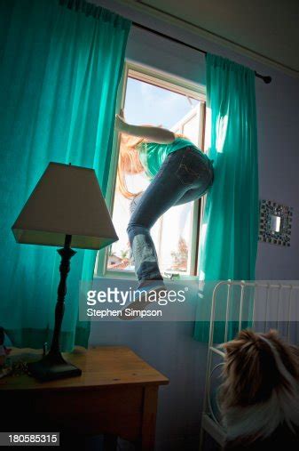 Teen Girl Sneaking Out Her Bedroom Window Photo Getty Images