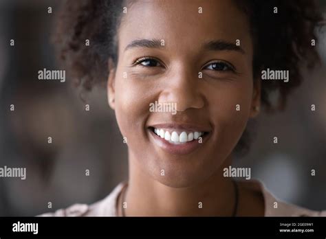 Portrait Of Smiling African American Woman Show White Teeth Stock Photo