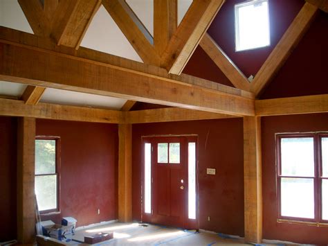 Exposed oak king post truss above partition wall frame (5564). Exposed beams with vaulted ceilings ©Balducci Additions ...