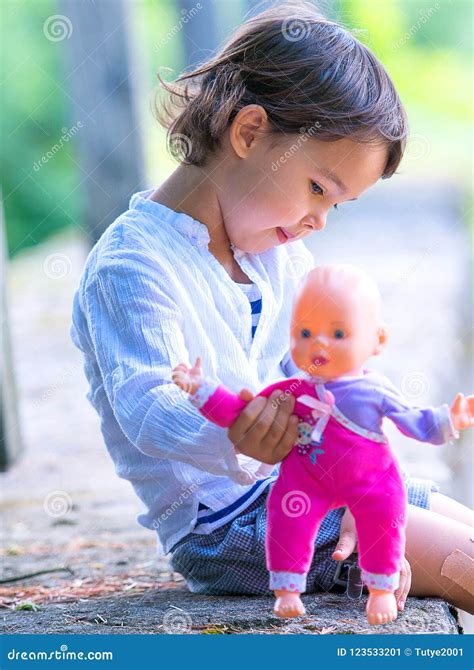 Cute Little Girl Holding Her Doll Stock Image Image Of Holding