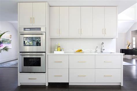 White flat panel kitchen cabinets google search kitchen. LIght Gray Kitchen Drawers with Brass Pulls - Contemporary ...