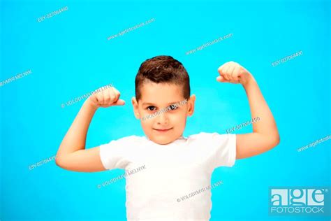 Beauty Smiling Sport Child Boy Showing His Hand Biceps Muscles Strength