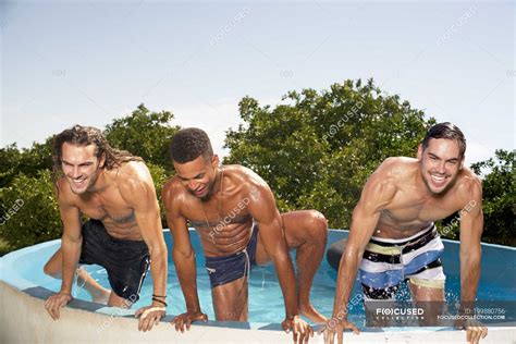 Men Climbing Out Of Swimming Pool — Getting Out Friendship Stock