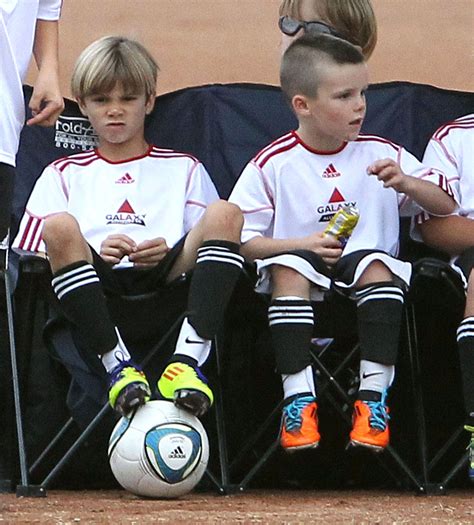 Victoria and David Beckham Cuddle Close Watching Their Boys Play Soccer