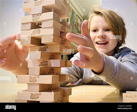 Boy Playing Jenga Stock Photo Alamy