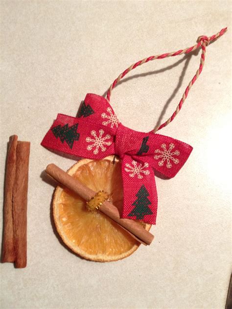 T Ornament Is Made By Dry Orange Cinnamon Sticks And Some Ribbon