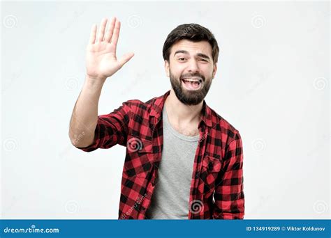 Friendly Looking Polite Young Hispanic Man Dressed In Checkered Shirt