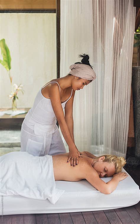 Woman Undergoing A Massage Treatment By Stocksy Contributor Lumina