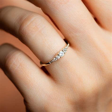 A Womans Hand With A Diamond Ring On It