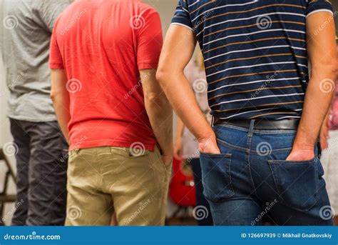 Back View Of Three Men Man With Hands In Back Pockets Stock Image