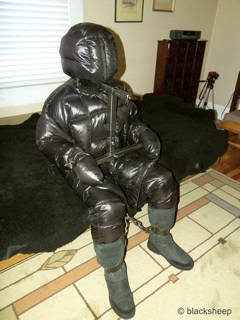 Heavy Black Shiny Down Outfit And Metal Shackles Down Bondage In Kuscheln