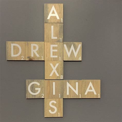 A Cross Made Out Of Scrabble Tiles With The Words Draw Gina Spelled On It