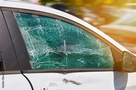 Smashed And Cracked Side Car Window Glass Of Parked Vehicle Damaged