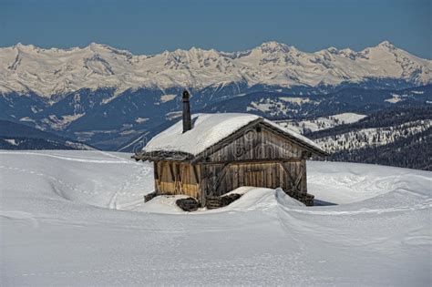 A Wood Cabin Hut In The Winter Snow Background Stock Image