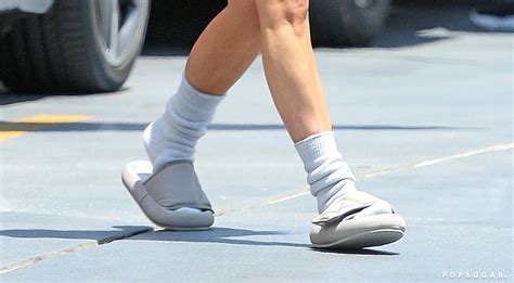 kim kardashian wearing yeezy slides and socks popsugar fashion uk photo 4