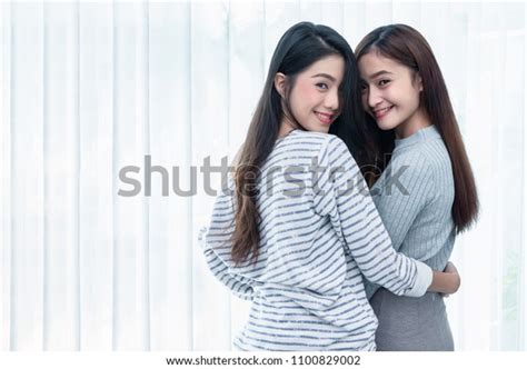 Two Asian Lesbian Women Looking Together Stock Photo