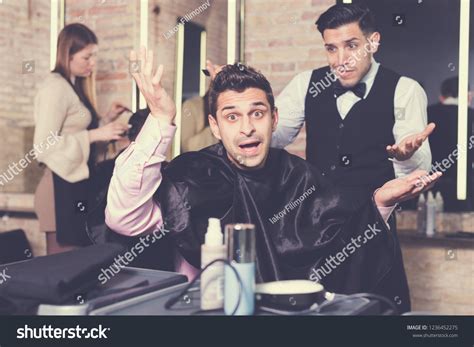 Man Unpleasantly Surprised By Haircut Hairdresser Stock Photo