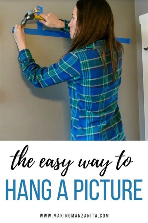 How To Hang A Picture The Easy Way Hanging Pictures Picture Hanging Tips Hanging Pictures On