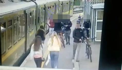 Vile Moment Yobs Knock Teenage Girl Onto Train Tracks After Spitting At Friend