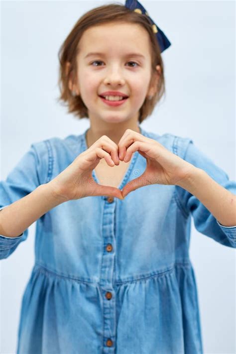 Smiling Little Girl Make Heart Sign With Hands Stock Photo Image Of