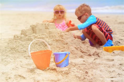 Kids Play With Sand On Summer Beach Stock Photo Image Of Playful
