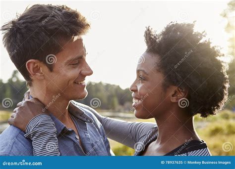 Happy Mixed Race Couple Embracing In The Countryside Stock Image Image Of Away Black 78937635