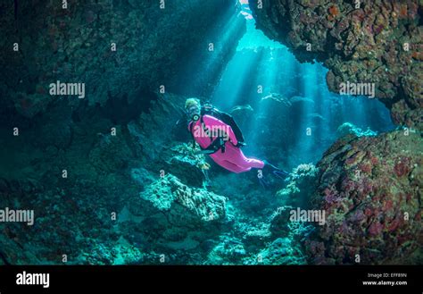 Female Scuba Diver Exploring Underwater Caves Stock Photo Alamy