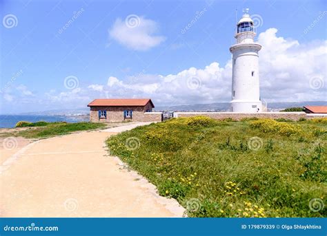 Lighthouse White Against the Blue Sky. Symbol of Hope and Faith in the