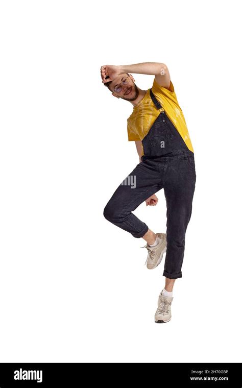 Full Length Portrait Of A Funny Guy Dancing In Studio Isolated On White