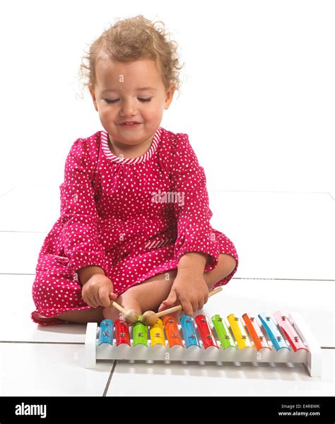 Young Girl 2 Years Playing With Colourful Toy Xylophone Stock Photo