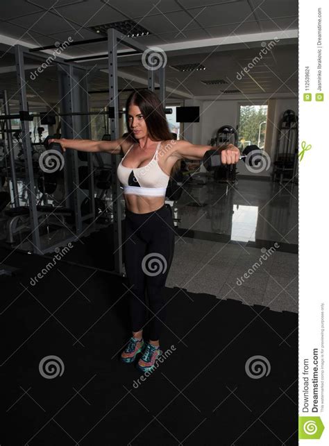 Woman Athlete Exercising Shoulder With Dumbbells Stock Photo Image Of